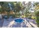 An outdoor hot tub area with multiple chairs sits in front of trees on a sunny day at 9705 E Mountain View Rd # 1056, Scottsdale, AZ 85258