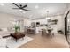 Open-concept living room showcasing a modern kitchen, dining area, and comfortable seating at 9705 E Mountain View Rd # 1056, Scottsdale, AZ 85258