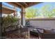 Relax on this outdoor patio with comfortable seating and a lush garden backdrop at 9705 E Mountain View Rd # 1056, Scottsdale, AZ 85258