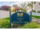 Welcome to The Racquet Club sign with lush landscaping and trees at 9705 E Mountain View Rd # 1056, Scottsdale, AZ 85258