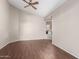 A spacious bedroom with wood-look floors and a ceiling fan for added comfort at 10012 W Runion Dr, Peoria, AZ 85382