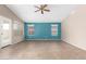 This bedroom features tile flooring, neutral paint, and a ceiling fan at 10012 W Runion Dr, Peoria, AZ 85382
