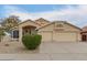 Inviting home featuring a 2-car garage, neutral stucco exterior, and low-maintenance desert landscaping at 10012 W Runion Dr, Peoria, AZ 85382