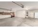A spacious garage with storage cabinets, a water heater, and a refrigerator at 10012 W Runion Dr, Peoria, AZ 85382