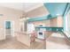 Bright eat-in kitchen with an island and white appliances, plenty of natural light at 10012 W Runion Dr, Peoria, AZ 85382