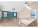 Open living room with natural light and a view into the kitchen at 10012 W Runion Dr, Peoria, AZ 85382