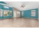 Bright and airy living room featuring a vaulted ceiling, tile floors and ample natural light at 10012 W Runion Dr, Peoria, AZ 85382
