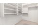 Walk-in closet with built-in shelving and ample storage space at 10012 W Runion Dr, Peoria, AZ 85382