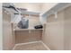 Walk-in closet with built-in shelving and ample hanging space at 1197 W Rolls Rd, San Tan Valley, AZ 85143