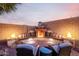 Inviting outdoor fire pit with comfortable seating, perfect for cozy evenings and relaxing at 1197 W Rolls Rd, San Tan Valley, AZ 85143