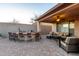Cozy covered patio featuring comfortable seating and an outdoor bar, ideal for enjoying the outdoors at 1197 W Rolls Rd, San Tan Valley, AZ 85143