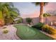 Backyard putting green, a perfect recreational space for practicing your short game at 1197 W Rolls Rd, San Tan Valley, AZ 85143