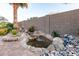 Outdoor water feature that adds serenity to the landscape, surrounded by rocks and plants at 1197 W Rolls Rd, San Tan Valley, AZ 85143