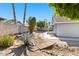 Landscaped backyard featuring desert plants, rock beds, and a quaint wooden bridge over a dry creek bed at 1209 N 87Th St, Scottsdale, AZ 85257