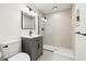 Modern bathroom featuring a sleek vanity, glass-enclosed shower, and neutral color palette at 1209 N 87Th St, Scottsdale, AZ 85257