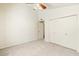 Bright bedroom features neutral carpeting, light paint, and a spacious closet with double doors at 1209 N 87Th St, Scottsdale, AZ 85257