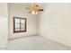 Bright bedroom with neutral carpet, light paint, and a window for natural light at 1209 N 87Th St, Scottsdale, AZ 85257