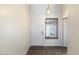Bright foyer featuring a tiled floor, front door, and a window letting in plenty of natural light at 1209 N 87Th St, Scottsdale, AZ 85257
