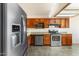 Functional kitchen featuring stainless steel appliances and wood cabinets for ample storage space at 1209 N 87Th St, Scottsdale, AZ 85257