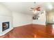 Spacious living room with hardwood floors, a fireplace, and easy access to the kitchen at 1209 N 87Th St, Scottsdale, AZ 85257