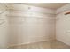Walk-in closet provides ample storage space with sturdy shelving at 1209 N 87Th St, Scottsdale, AZ 85257