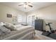 Comfortable bedroom with ceiling fan, exterior access door, and carpeted flooring at 12438 N Saguaro Blvd # 108, Fountain Hills, AZ 85268