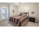 Comfortable bedroom with an outdoor door leading to a patio at 12438 N Saguaro Blvd # 108, Fountain Hills, AZ 85268