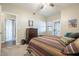 Bedroom featuring carpeted floor, ceiling fan, and exterior access door at 12438 N Saguaro Blvd # 108, Fountain Hills, AZ 85268
