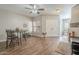 Inviting dining area with wood floors and a view into the living room at 12438 N Saguaro Blvd # 108, Fountain Hills, AZ 85268