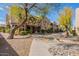Attractive exterior of the building with desert landscaping and walkway at 12438 N Saguaro Blvd # 108, Fountain Hills, AZ 85268