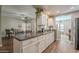 Bright kitchen with ample counter space, white cabinetry, and open floorplan at 12438 N Saguaro Blvd # 108, Fountain Hills, AZ 85268