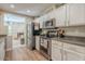 Well-equipped kitchen with stainless steel appliances and views to living area at 12438 N Saguaro Blvd # 108, Fountain Hills, AZ 85268