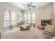 Relaxing living room with fireplace, comfortable seating, and bright windows at 12438 N Saguaro Blvd # 108, Fountain Hills, AZ 85268