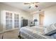 Bright main bedroom with a private outdoor patio and neutral tones at 12438 N Saguaro Blvd # 108, Fountain Hills, AZ 85268
