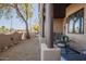 Charming patio with wooden pillars, seating, and view of the desert landscape at 12438 N Saguaro Blvd # 108, Fountain Hills, AZ 85268
