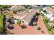Detailed aerial view of the property with a covered patio and desert landscaping at 12915 W Micheltorena Dr, Sun City West, AZ 85375