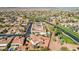 Expansive aerial view of a community featuring lush desert landscaping and well-maintained streets at 12915 W Micheltorena Dr, Sun City West, AZ 85375