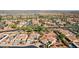 Scenic aerial view of a neighborhood near a golf course, with well-maintained homes and desert landscaping at 12915 W Micheltorena Dr, Sun City West, AZ 85375