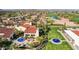 Overhead shot of a community clubhouse, surrounded by landscaped grounds and manicured greenery with beautiful fountains at 12915 W Micheltorena Dr, Sun City West, AZ 85375