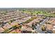 Beautiful aerial view of a residential area, showcasing well-kept homes, lush greenery, and a nearby golf course at 12915 W Micheltorena Dr, Sun City West, AZ 85375