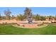 Beautiful community entrance with a fountain and lush landscaping at 12915 W Micheltorena Dr, Sun City West, AZ 85375