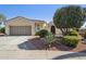 Charming home with desert landscaping, two car garage, and an arched entryway at 12915 W Micheltorena Dr, Sun City West, AZ 85375