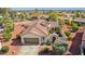 Beautiful home featuring a barrel tile roof, two car garage, and desert landscaping at 12915 W Micheltorena Dr, Sun City West, AZ 85375