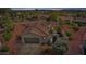 Inviting home featuring a barrel tile roof, two car garage, and desert landscaping at 12915 W Micheltorena Dr, Sun City West, AZ 85375