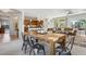 Open living space seamlessly connects the dining area, kitchen, and living room, perfect for entertaining at 12915 W Micheltorena Dr, Sun City West, AZ 85375