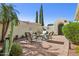 Cozy outdoor seating area with charming desert landscaping and beautiful stucco walls at 12915 W Micheltorena Dr, Sun City West, AZ 85375