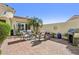 Spacious patio area with outdoor seating, beautiful desert plants, and a built in grill at 12915 W Micheltorena Dr, Sun City West, AZ 85375
