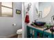 Bathroom with a blue vessel sink and a round mirror at 13331 W Romain Ct, Litchfield Park, AZ 85340