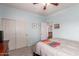 Well-lit bedroom with modern sliding door closet leading to the main house at 13331 W Romain Ct, Litchfield Park, AZ 85340