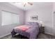 Bedroom featuring a plush queen-size bed and cozy decor for relaxation at 13331 W Romain Ct, Litchfield Park, AZ 85340